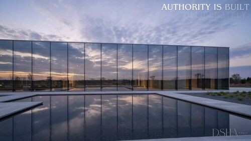 Reflective glass building representing deliberate authority in the DSHA Media film