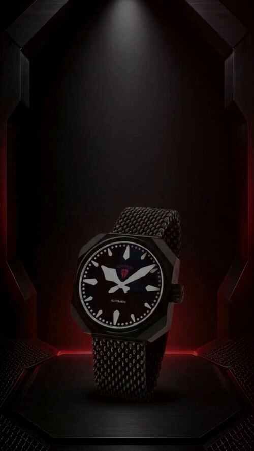 Normalzeit watch presented under a spotlight on an octagonal stage
