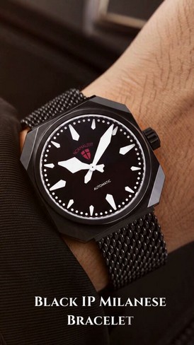 Normalzeit black automatic watch worn with its Milanese bracelet